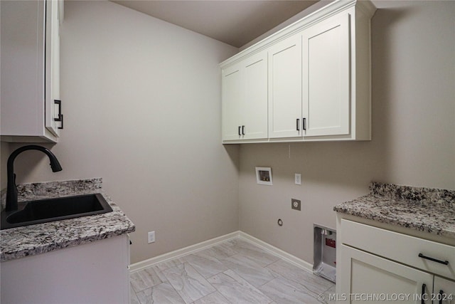 laundry area with sink, cabinets, hookup for a washing machine, electric dryer hookup, and hookup for a gas dryer