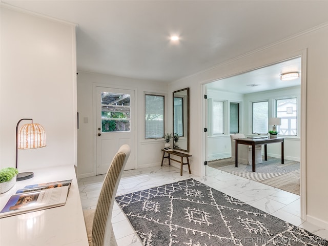 home office featuring ornamental molding, light tile flooring, and a healthy amount of sunlight