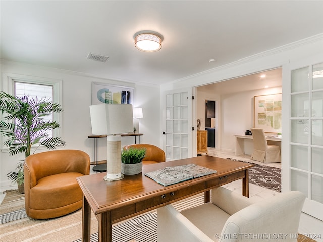 office space with french doors and crown molding