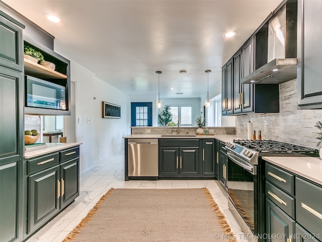 kitchen featuring light tile floors, sink, wall chimney range hood, decorative light fixtures, and stainless steel appliances