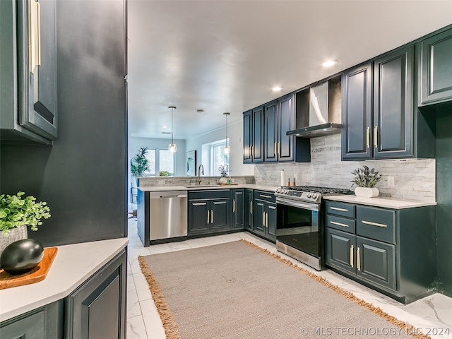 kitchen featuring pendant lighting, light tile flooring, appliances with stainless steel finishes, wall chimney range hood, and sink