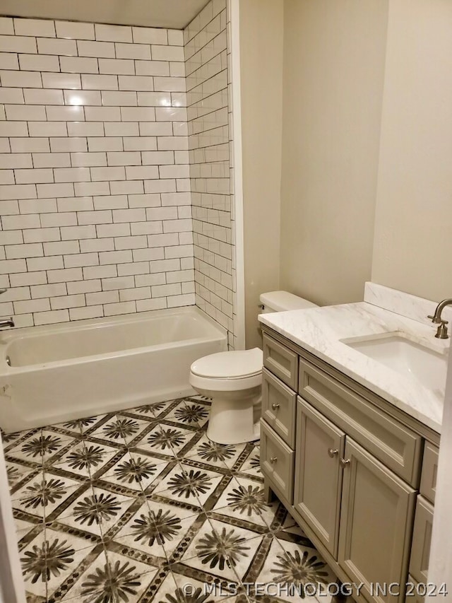 full bathroom with tiled shower / bath combo, tile flooring, toilet, and vanity