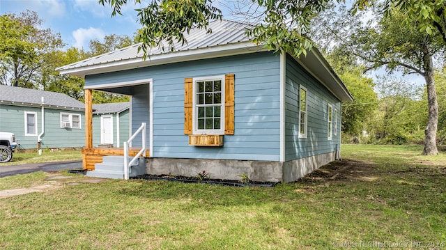 bungalow with a front yard