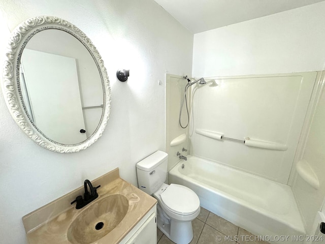 full bathroom with tile patterned floors, vanity, washtub / shower combination, and toilet