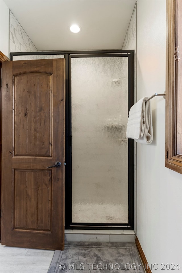 bathroom with hardwood / wood-style flooring