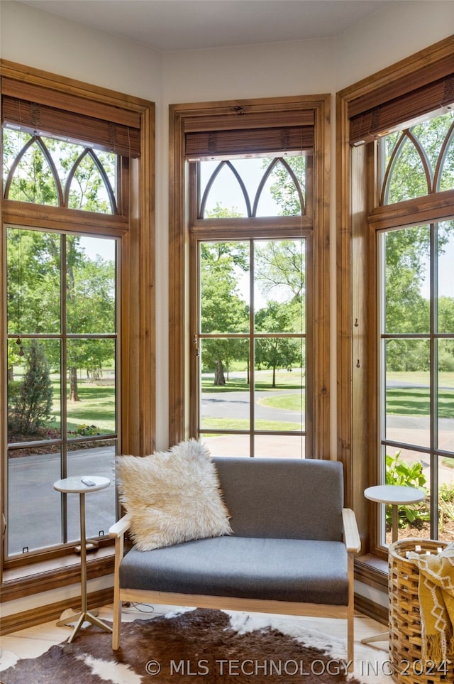 living room with wood-type flooring and a wealth of natural light