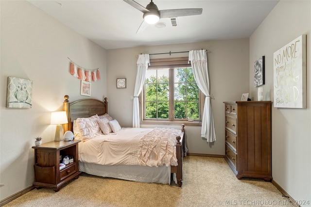 bedroom with light carpet and ceiling fan