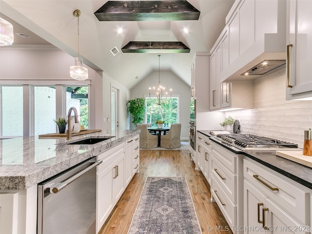 kitchen with white cabinets, light hardwood / wood-style flooring, a center island with sink, and stainless steel appliances