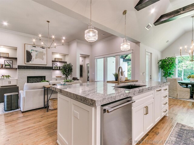 kitchen featuring light hardwood / wood-style flooring, a center island with sink, dishwasher, sink, and white cabinets