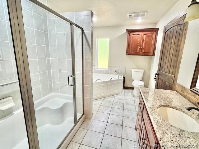 full bathroom featuring tile patterned floors, vanity, shower with separate bathtub, and toilet