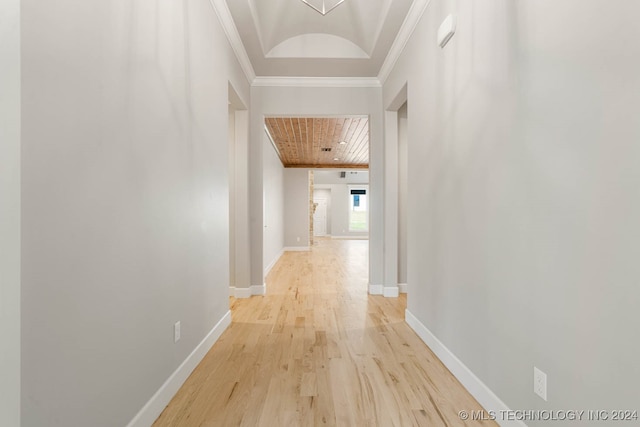 hallway featuring light hardwood / wood-style floors and ornamental molding