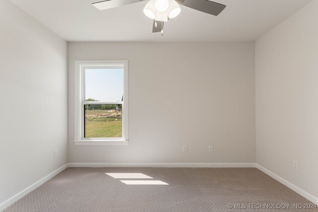 unfurnished room with ceiling fan and carpet floors