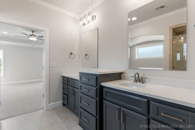 bathroom with crown molding, ceiling fan, vanity, and tile patterned floors