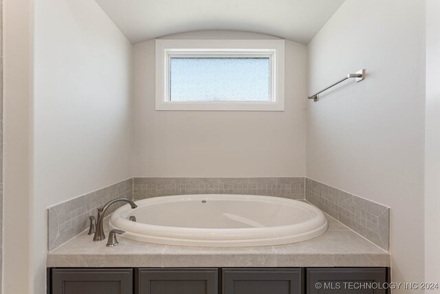 bathroom featuring a washtub