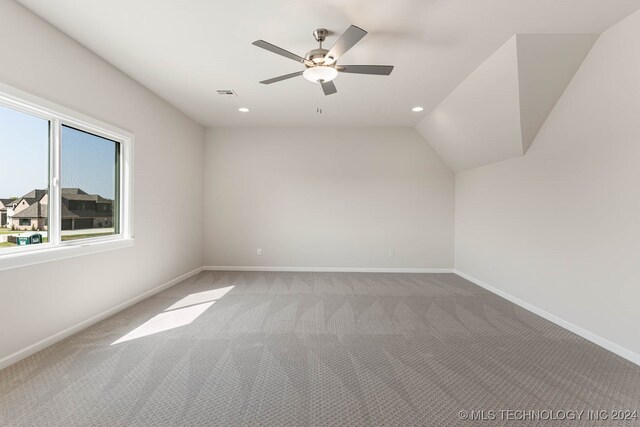 bonus room featuring ceiling fan, carpet, and vaulted ceiling