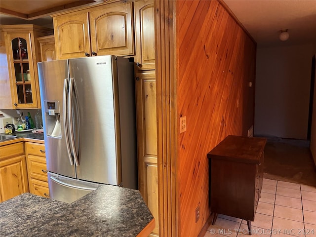 kitchen with stainless steel fridge and light tile patterned floors