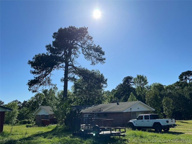 view of property exterior featuring a deck