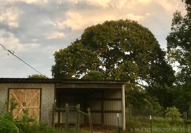 view of outdoor structure at dusk