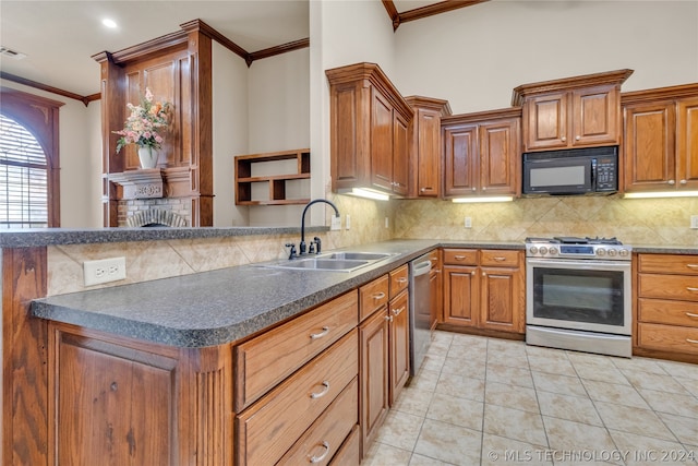 kitchen featuring sink, tasteful backsplash, stainless steel appliances, and light tile floors