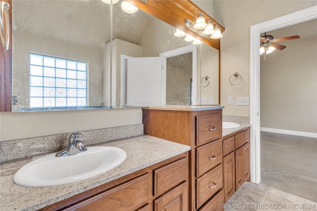 bathroom featuring wood-type flooring, ceiling fan, and vanity