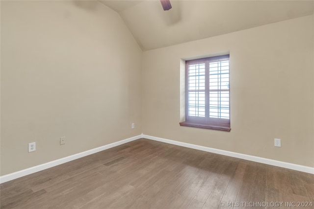 spare room featuring lofted ceiling, ceiling fan, and hardwood / wood-style flooring