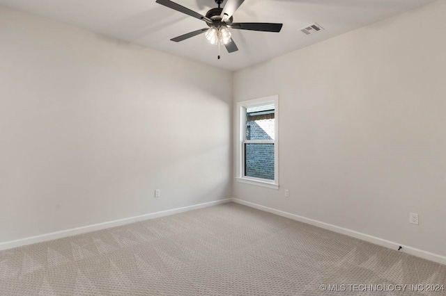 empty room featuring ceiling fan and carpet floors