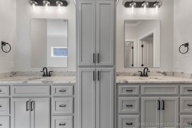 bathroom featuring vanity and ornamental molding