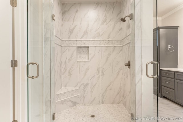 bathroom with walk in shower, vanity, and ornamental molding