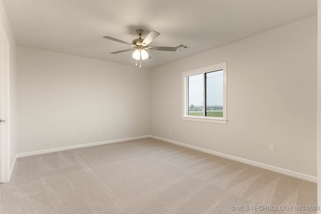 unfurnished room with ceiling fan and carpet floors