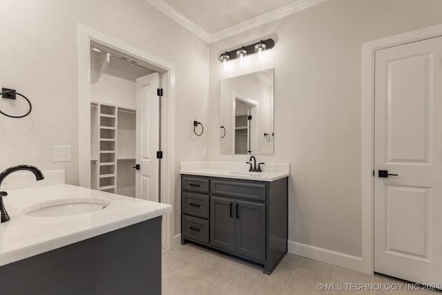 bathroom featuring vanity, ornamental molding, and tile patterned floors