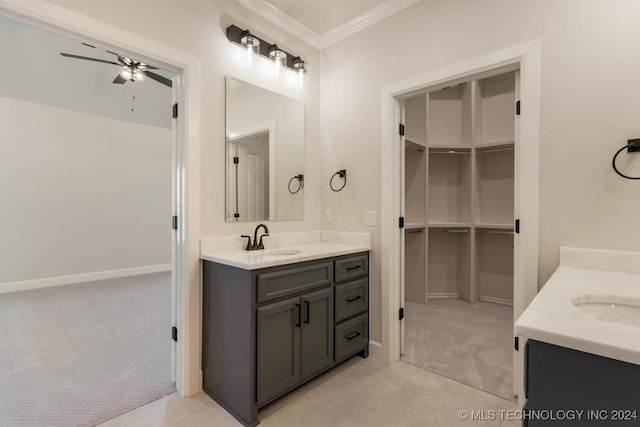 bathroom featuring crown molding, vanity, and ceiling fan