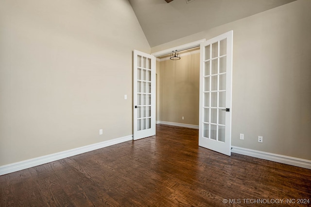 spare room with high vaulted ceiling, french doors, and dark hardwood / wood-style flooring