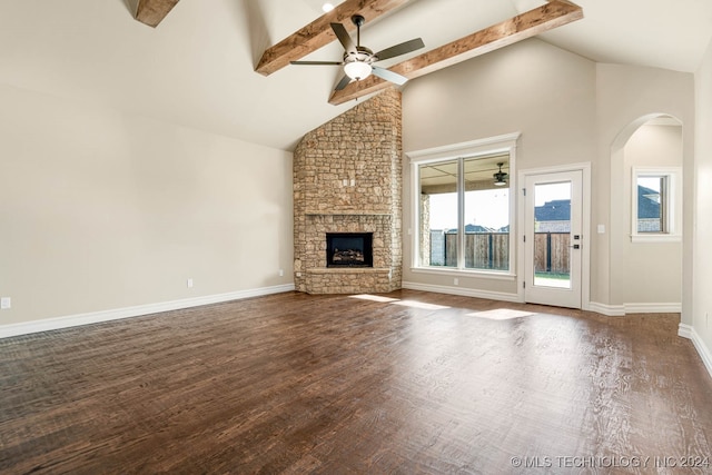 unfurnished living room with high vaulted ceiling, ceiling fan, beamed ceiling, and dark hardwood / wood-style floors