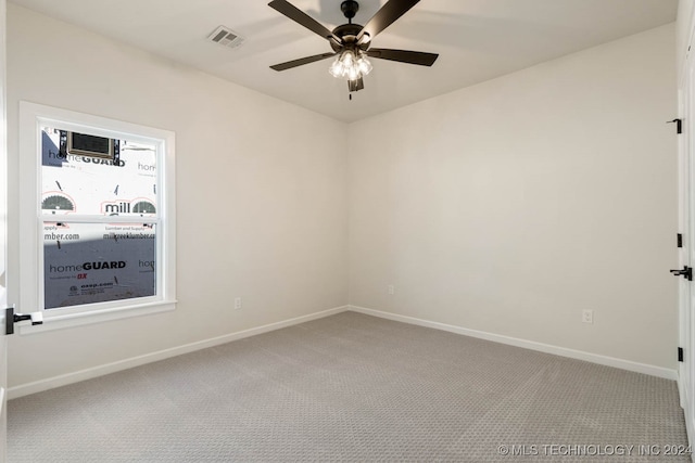 empty room with carpet and ceiling fan