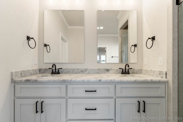 bathroom featuring vanity and crown molding