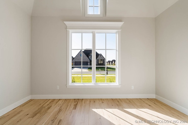 spare room with light hardwood / wood-style floors