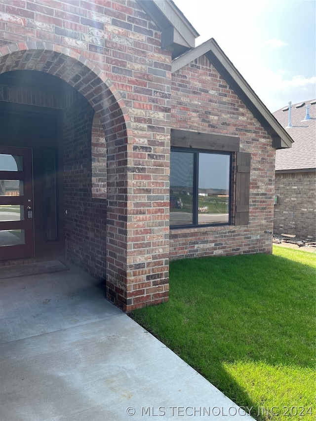 view of home's exterior with a lawn