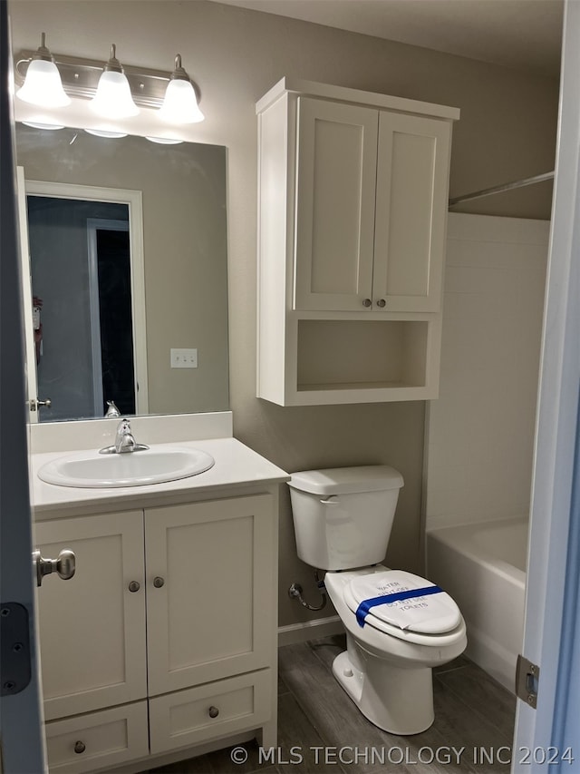 full bathroom with toilet, bathtub / shower combination, and vanity