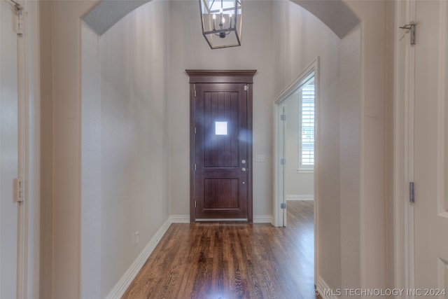 entryway with dark hardwood / wood-style flooring