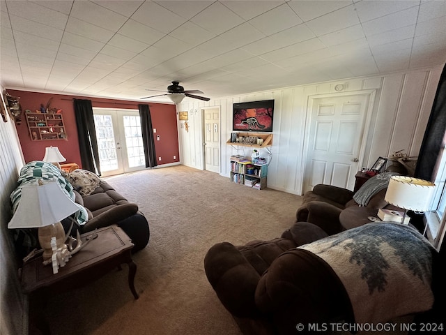 living room featuring french doors, carpet, and ceiling fan