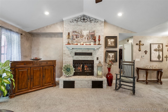 living room with light colored carpet, a fireplace, and vaulted ceiling