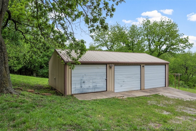 garage featuring a yard