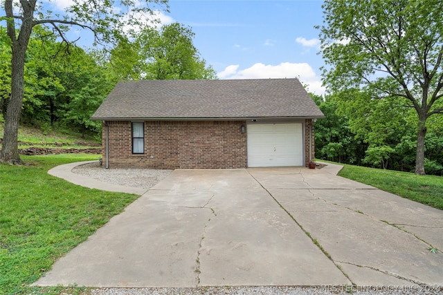 garage featuring a yard