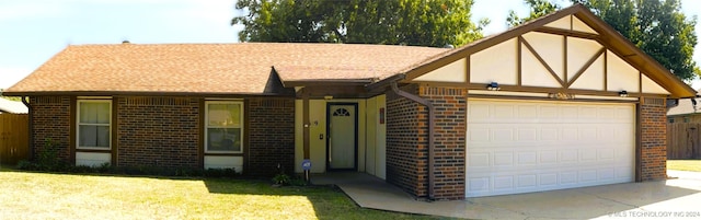 view of front of home featuring a garage and a front yard