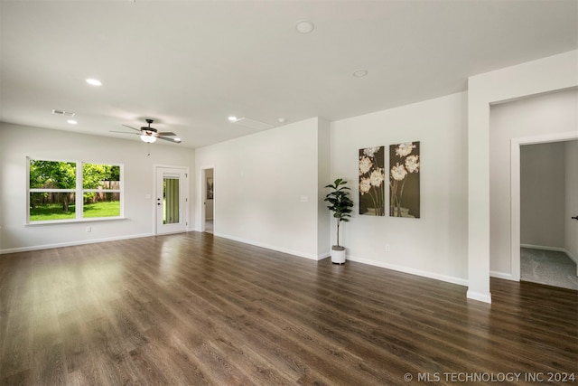 spare room featuring ceiling fan and dark hardwood / wood-style floors