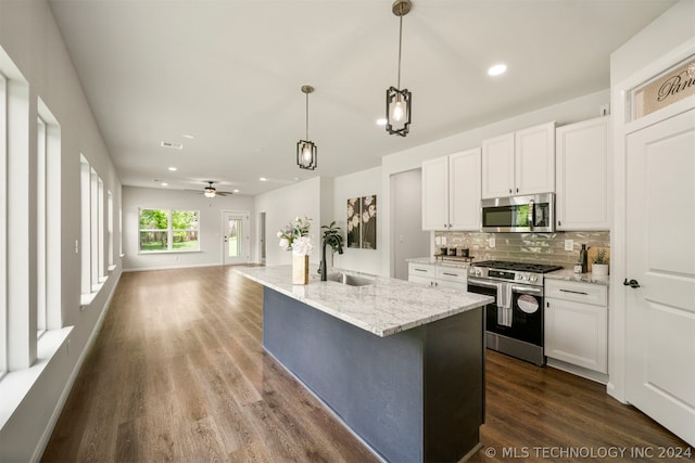 kitchen with ceiling fan, stainless steel appliances, dark hardwood / wood-style floors, white cabinetry, and sink