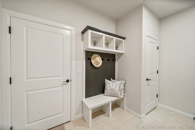 mudroom featuring light tile flooring