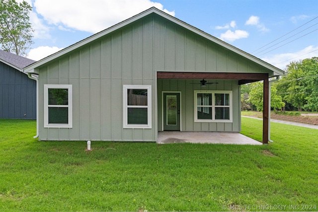 back of property featuring a patio, a yard, and ceiling fan