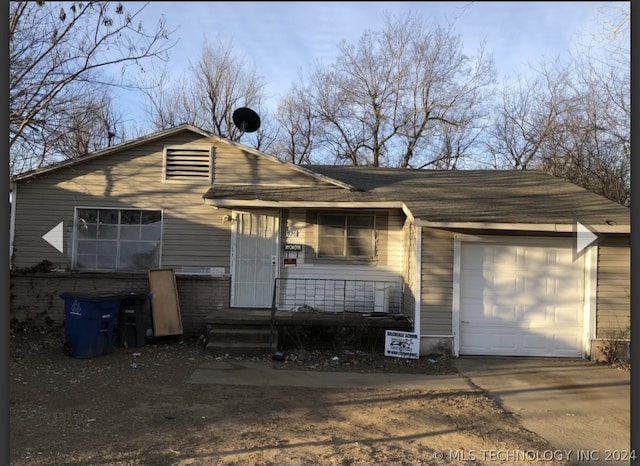 view of front of house with a garage and concrete driveway