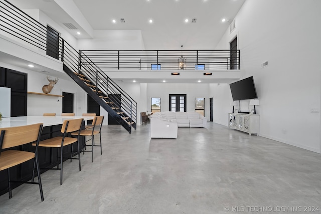 living room with a high ceiling